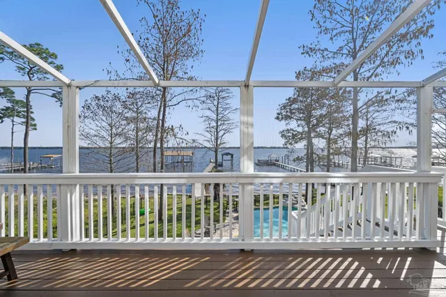 a bathroom with a toilet a sink and a mirror