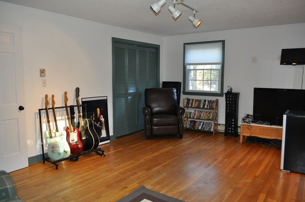 208 Worcester Road Princeton, MA 01541 - Photo 11 of 15 a living room with furniture and a flat screen tv