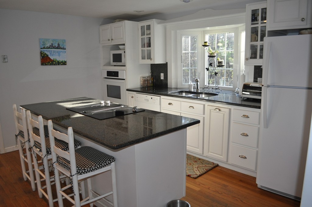 208 Worcester Road Princeton, MA 01541 - Photo 3 of 15 a kitchen with stainless steel appliances granite countertop a stove a sink and a refrigerator
