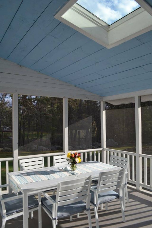 208 Worcester Road Princeton, MA 01541 - Photo 7 of 15 a view of a patio with a dining table and chairs