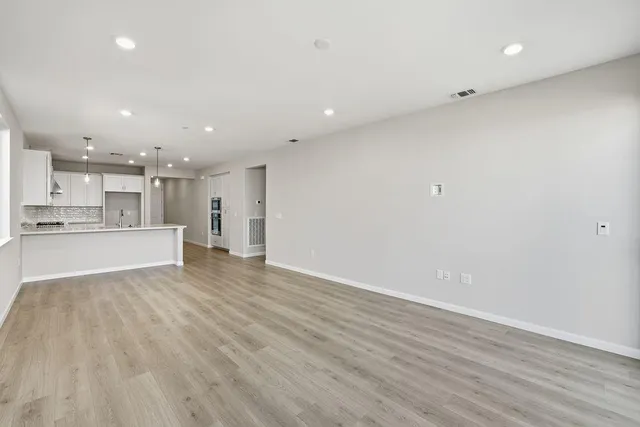 a view of livingroom with hardwood floor and hallway