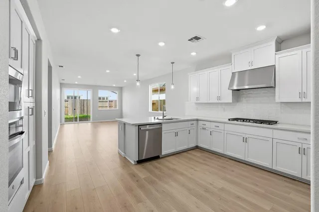 a view of kitchen with wooden floor