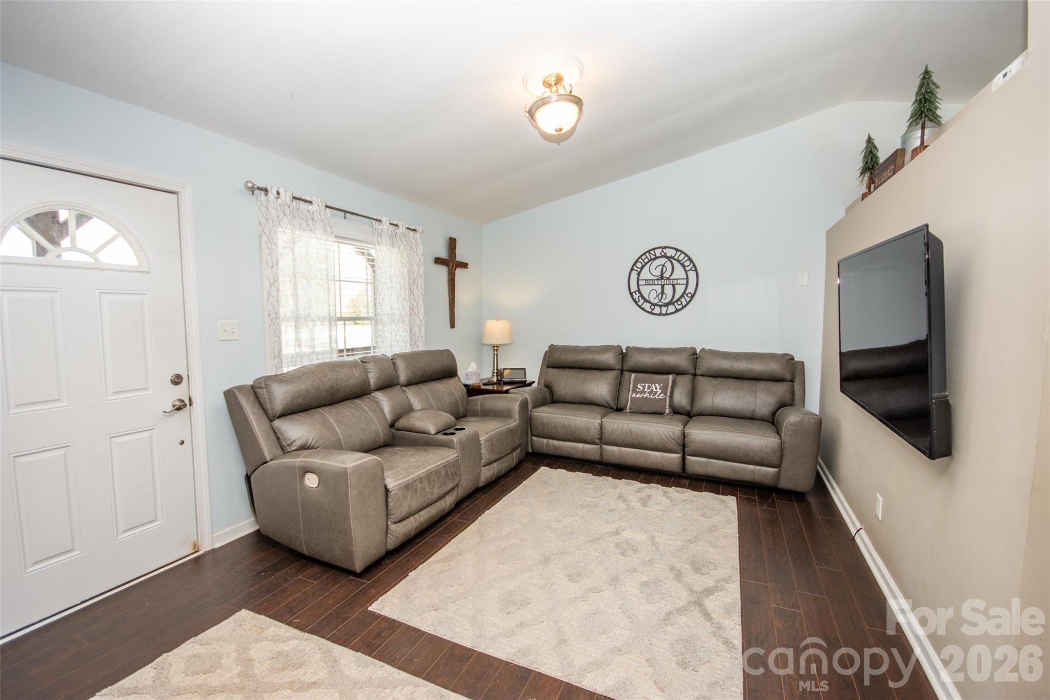 455 Mitch Road Union Grove, NC 28689 - Photo 13 of 44 a living room with furniture and a flat screen tv