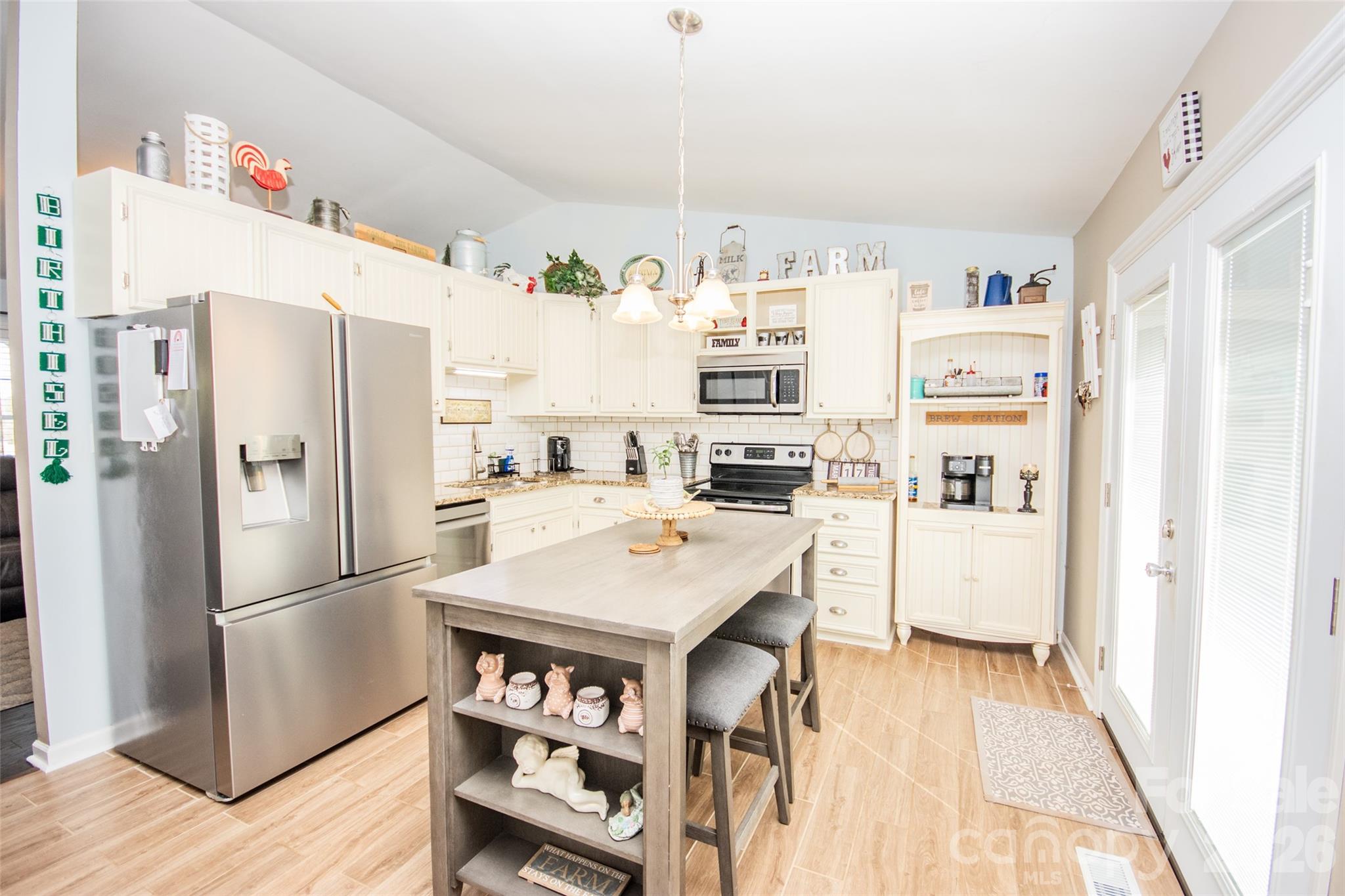 455 Mitch Road Union Grove, NC 28689 - Photo 17 of 44 a kitchen with stainless steel appliances a refrigerator and a stove top oven