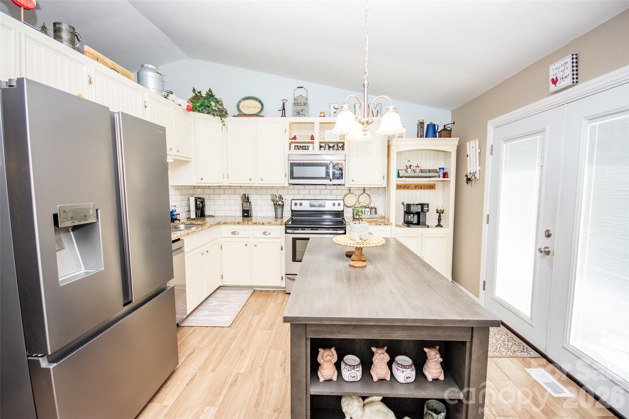 455 Mitch Road Union Grove, NC 28689 - Photo 18 of 44 a kitchen with stainless steel appliances a refrigerator a stove and a refrigerator