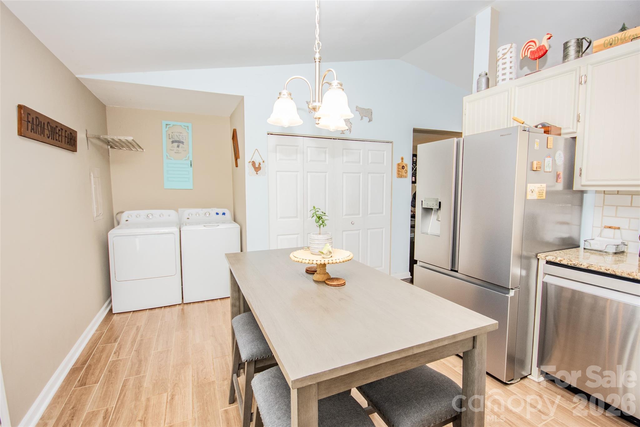 455 Mitch Road Union Grove, NC 28689 - Photo 19 of 44 a dining room with stainless steel appliances a table and chairs