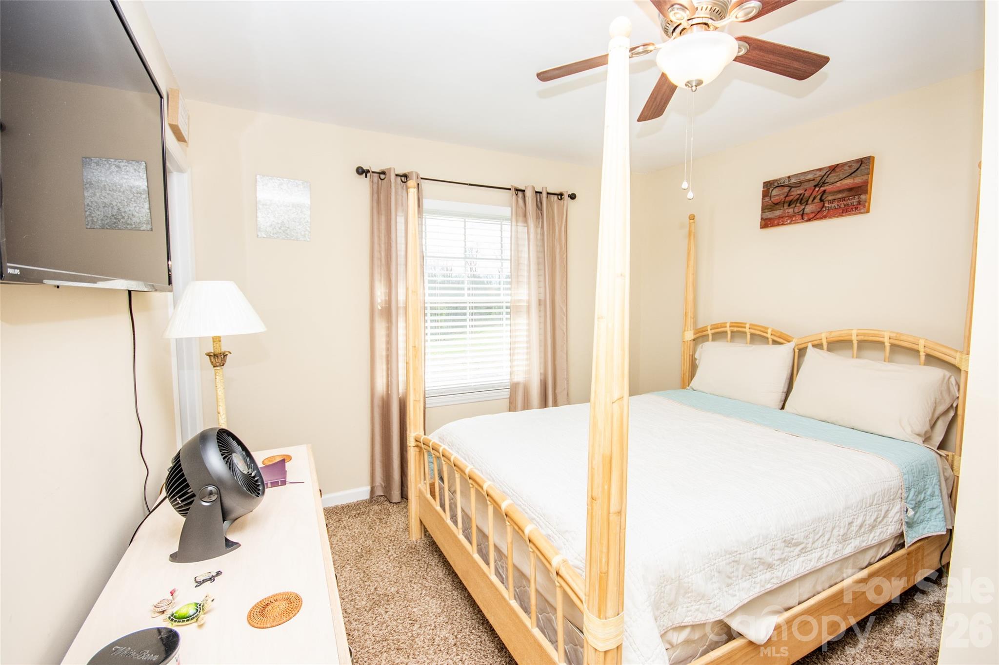 455 Mitch Road Union Grove, NC 28689 - Photo 25 of 44 a bedroom with a bed and a large mirror