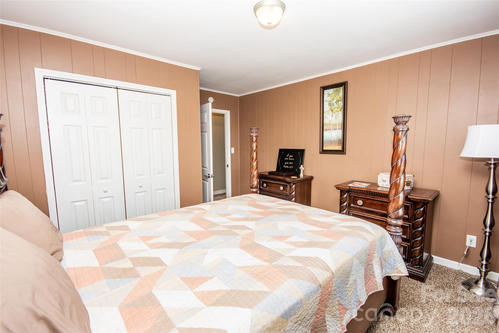 455 Mitch Road Union Grove, NC 28689 - Photo 27 of 44 a bedroom with a bed and wooden floor