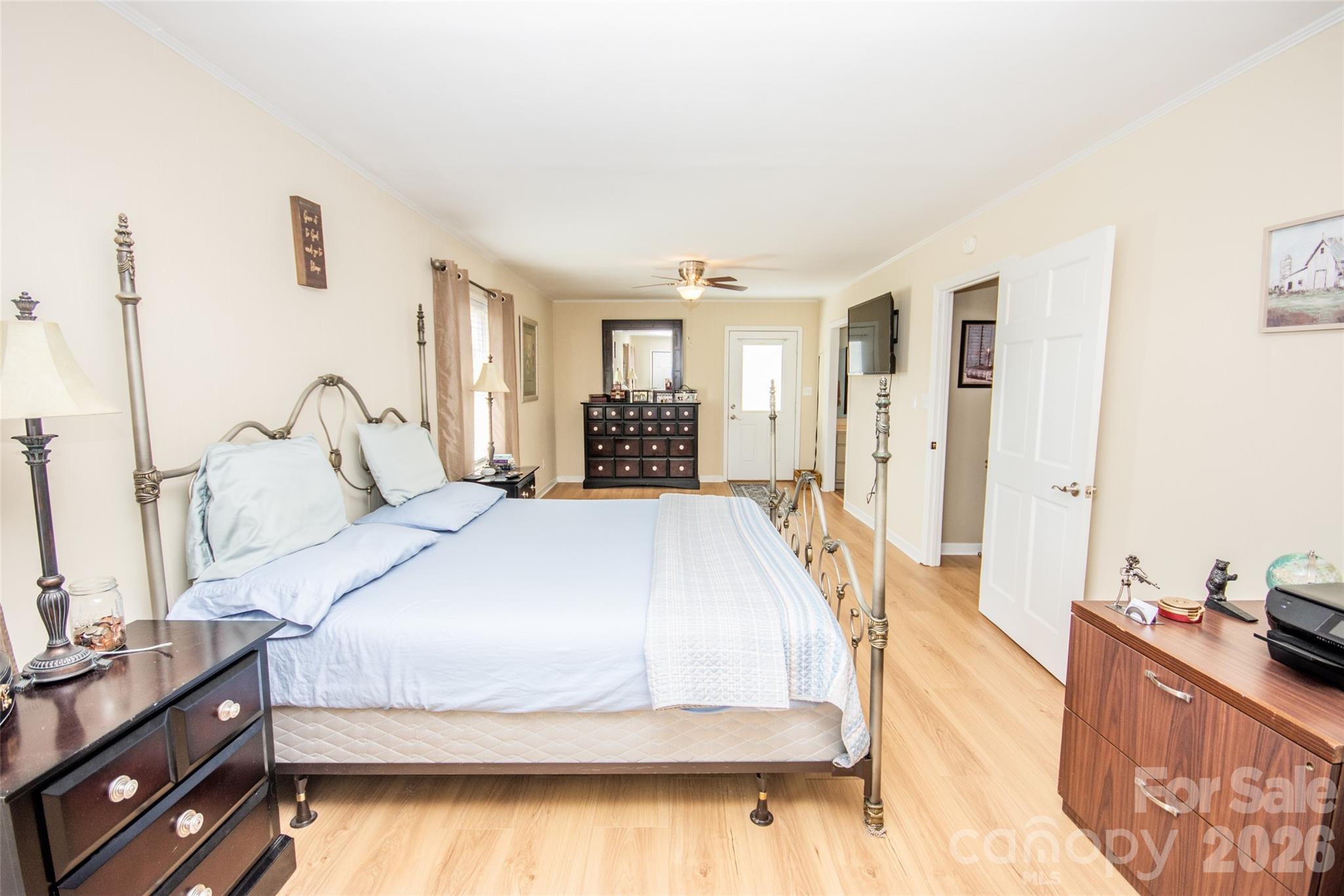 455 Mitch Road Union Grove, NC 28689 - Photo 32 of 44 a bedroom with a bed and wooden floor