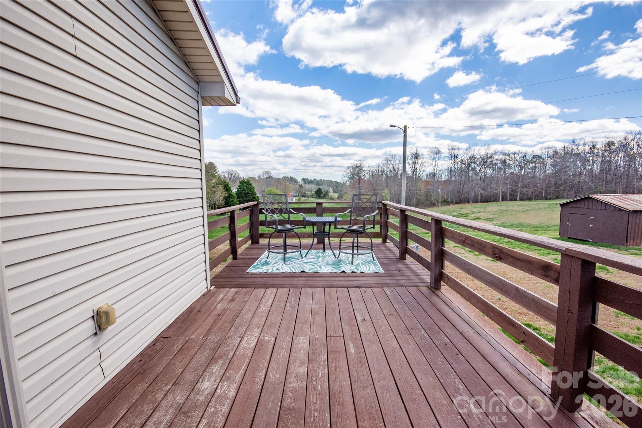 455 Mitch Road Union Grove, NC 28689 - Photo 36 of 44 a view of a balcony with wooden floor next to a yard