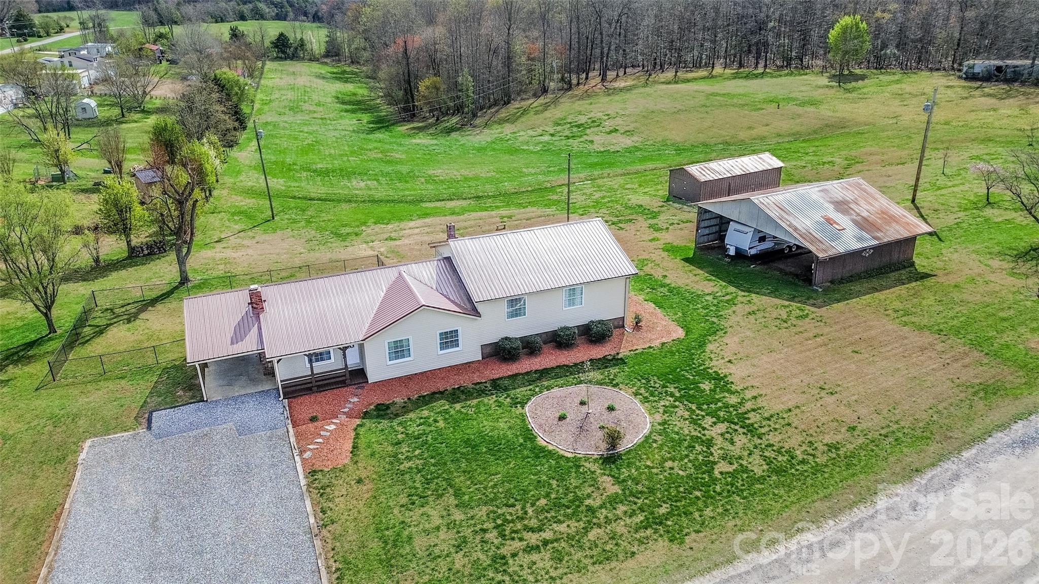 455 Mitch Road Union Grove, NC 28689 - Photo 5 of 44 an aerial view of a house with outdoor space