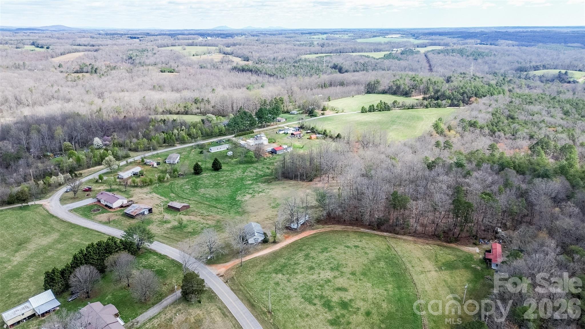 455 Mitch Road Union Grove, NC 28689 - Photo 9 of 44 an aerial view of green landscape with trees