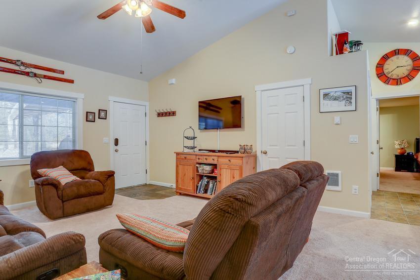17020 Glendale Road Bend, OR 97707 - Photo 2 of 24 a living room with furniture and a flat screen tv