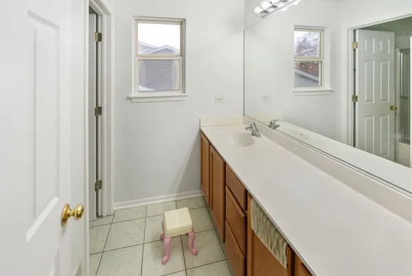 a bathroom with a sink a mirror and shower