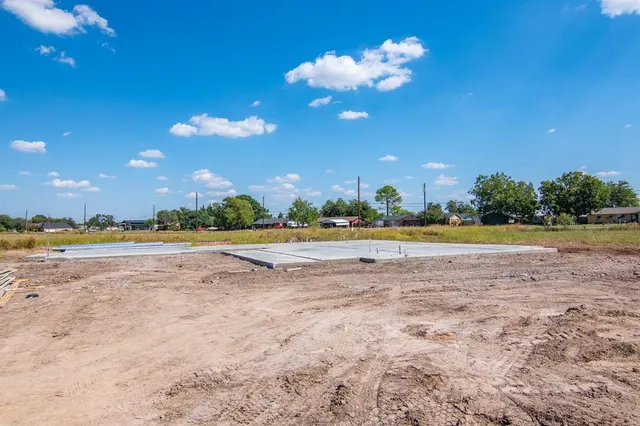 a view of a house with a swimming pool and a yard