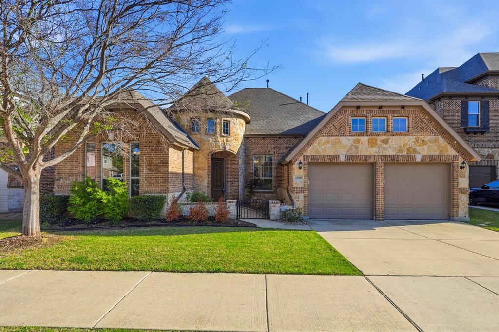 6800 Edwards Road Denton, TX 76208 - Photo 1 of 1 a front view of a house with a yard and garage