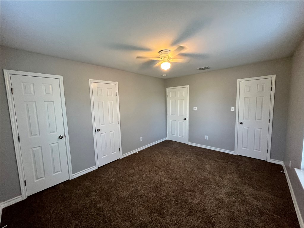 908 East Hefferman Street Beeville, TX 78102 - Photo 36 of 40 an empty room with windows and fan