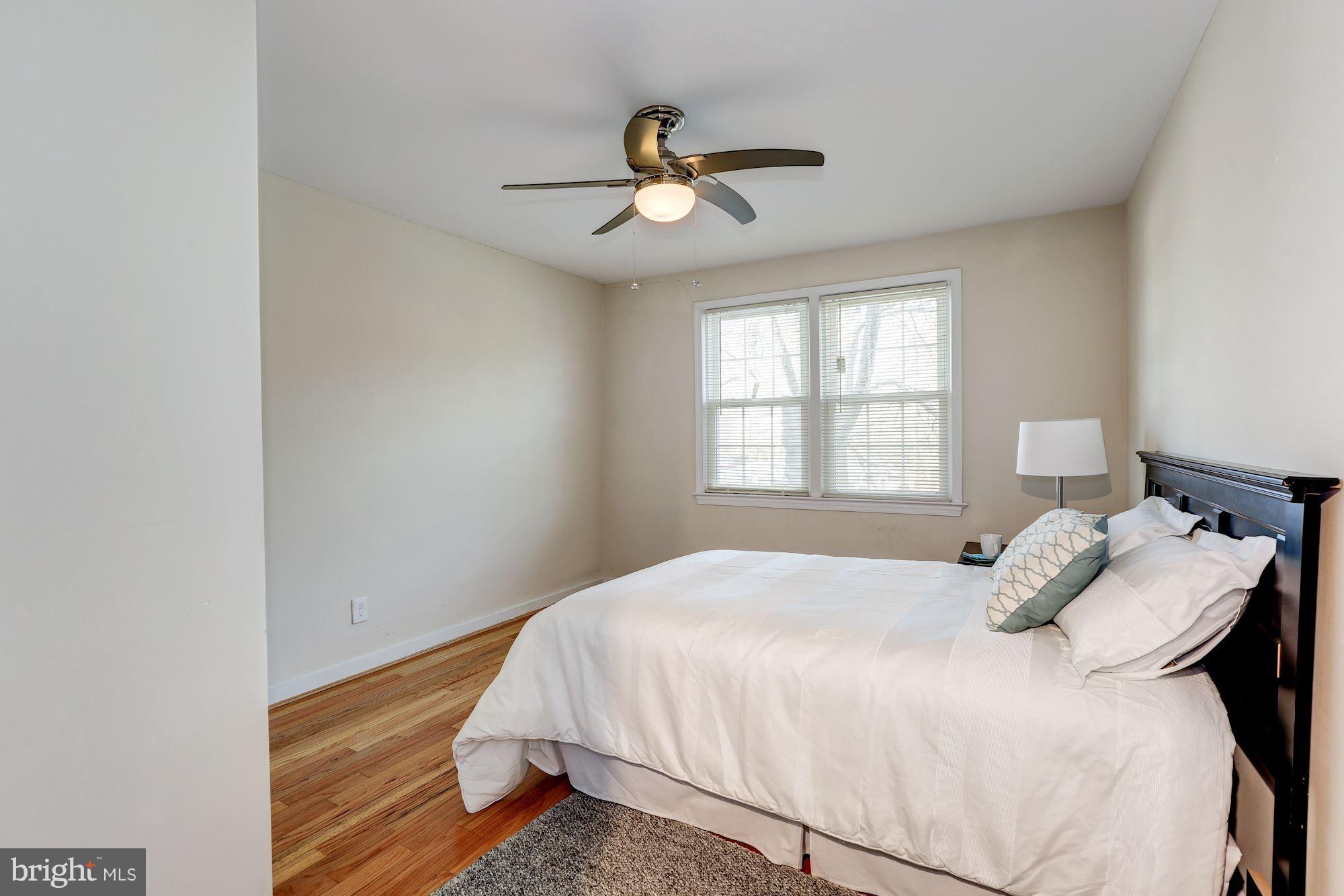 2248 Washington Avenue, Unit 203 Silver Spring, MD 20910 - Photo 15 of 29 a bedroom with a bed and window