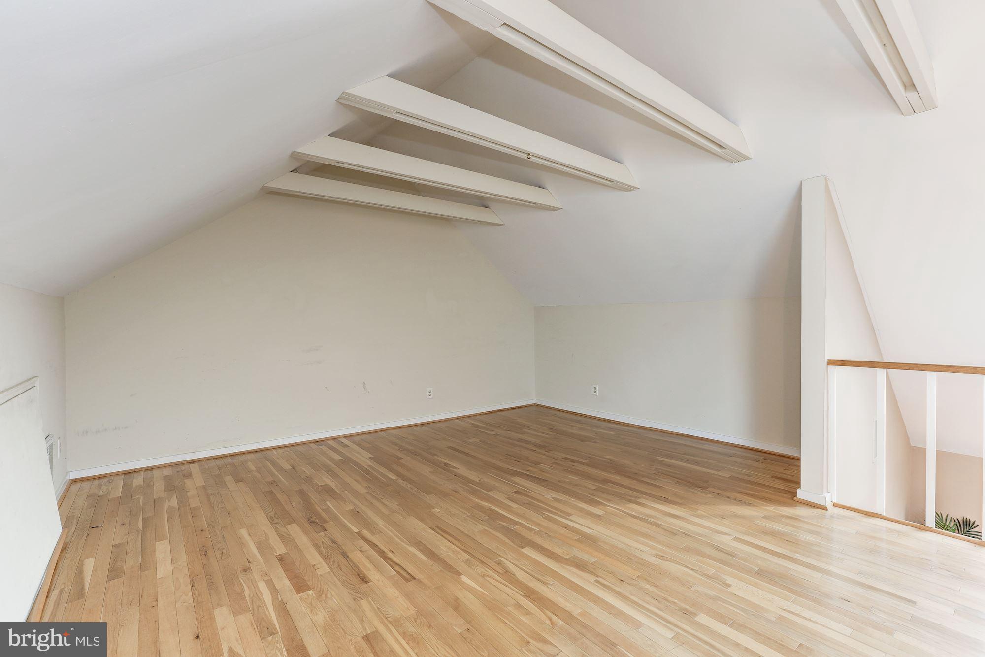 2248 Washington Avenue, Unit 203 Silver Spring, MD 20910 - Photo 26 of 29 a view of room with wooden floor