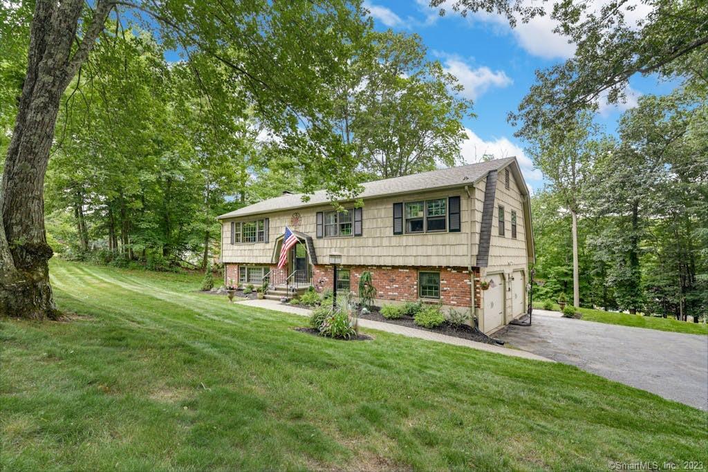 134 Longfellow Road Shelton, CT 06484 - Photo 1 of 1 a view of a house with backyard and a tree