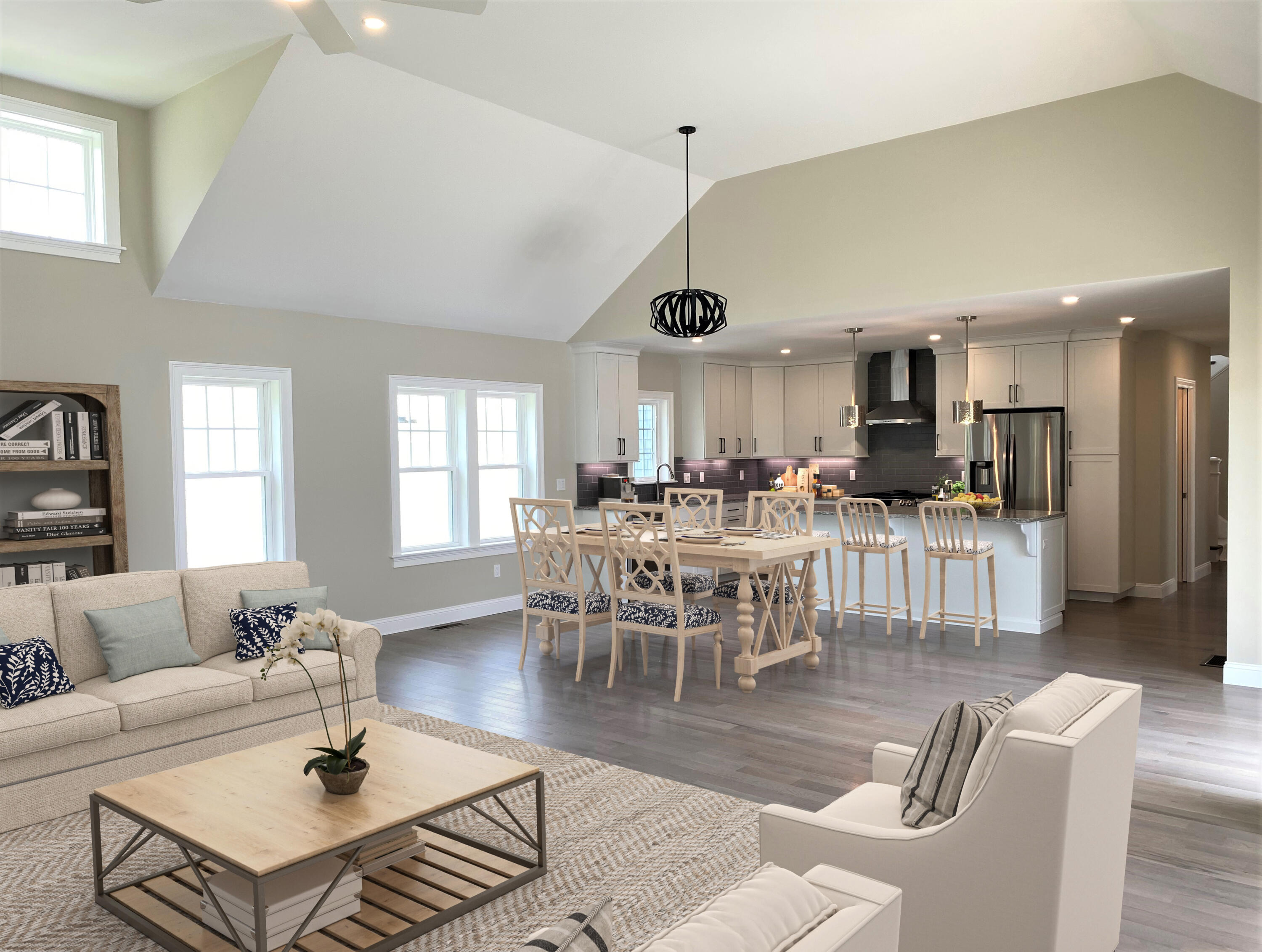 18 Cobblestone Circle Mashpee, MA 02649 - Photo 12 of 41 a living room with furniture a dining table and a chandelier