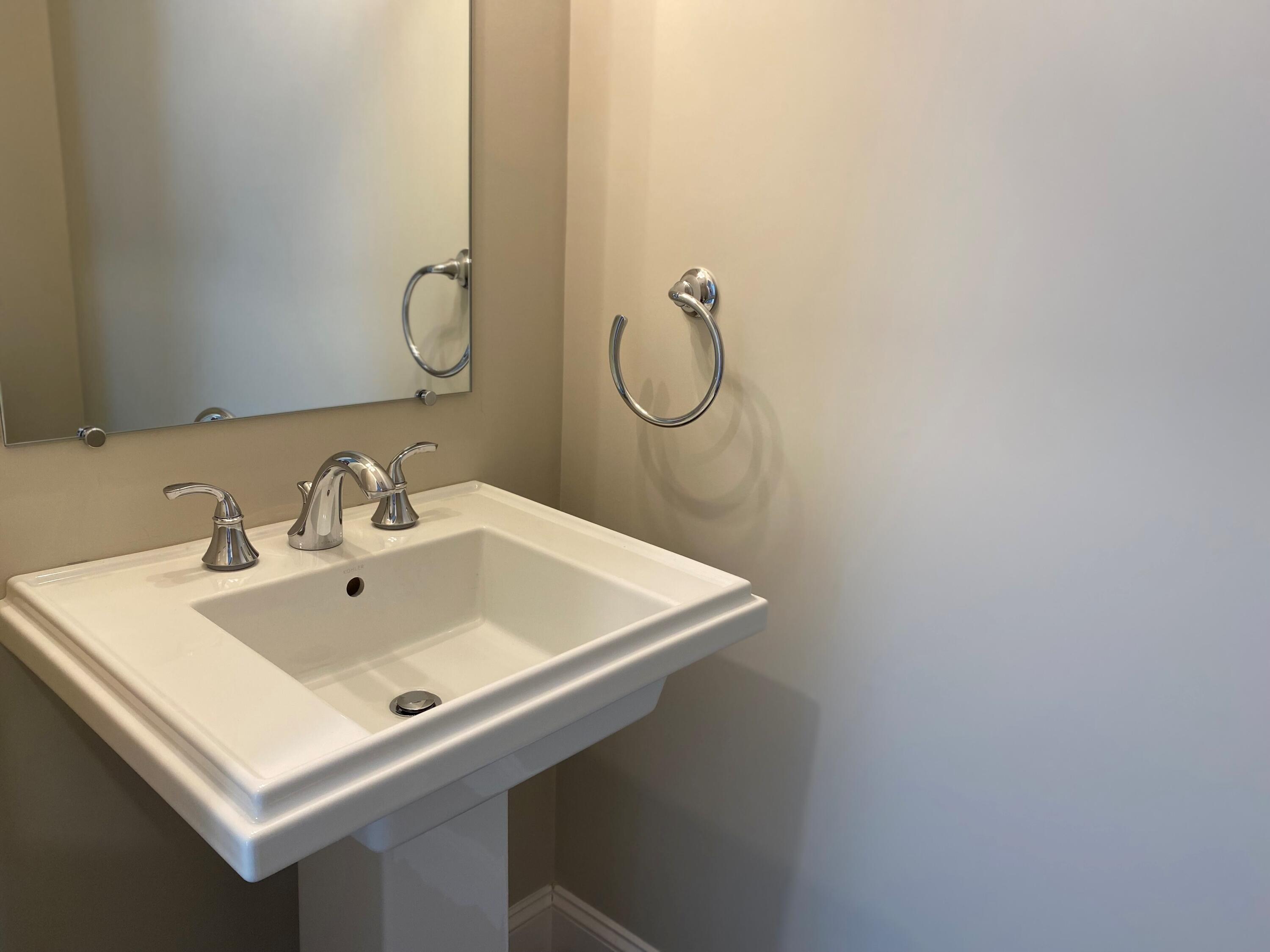 18 Cobblestone Circle Mashpee, MA 02649 - Photo 15 of 41 a white sink sitting under a bathroom mirror