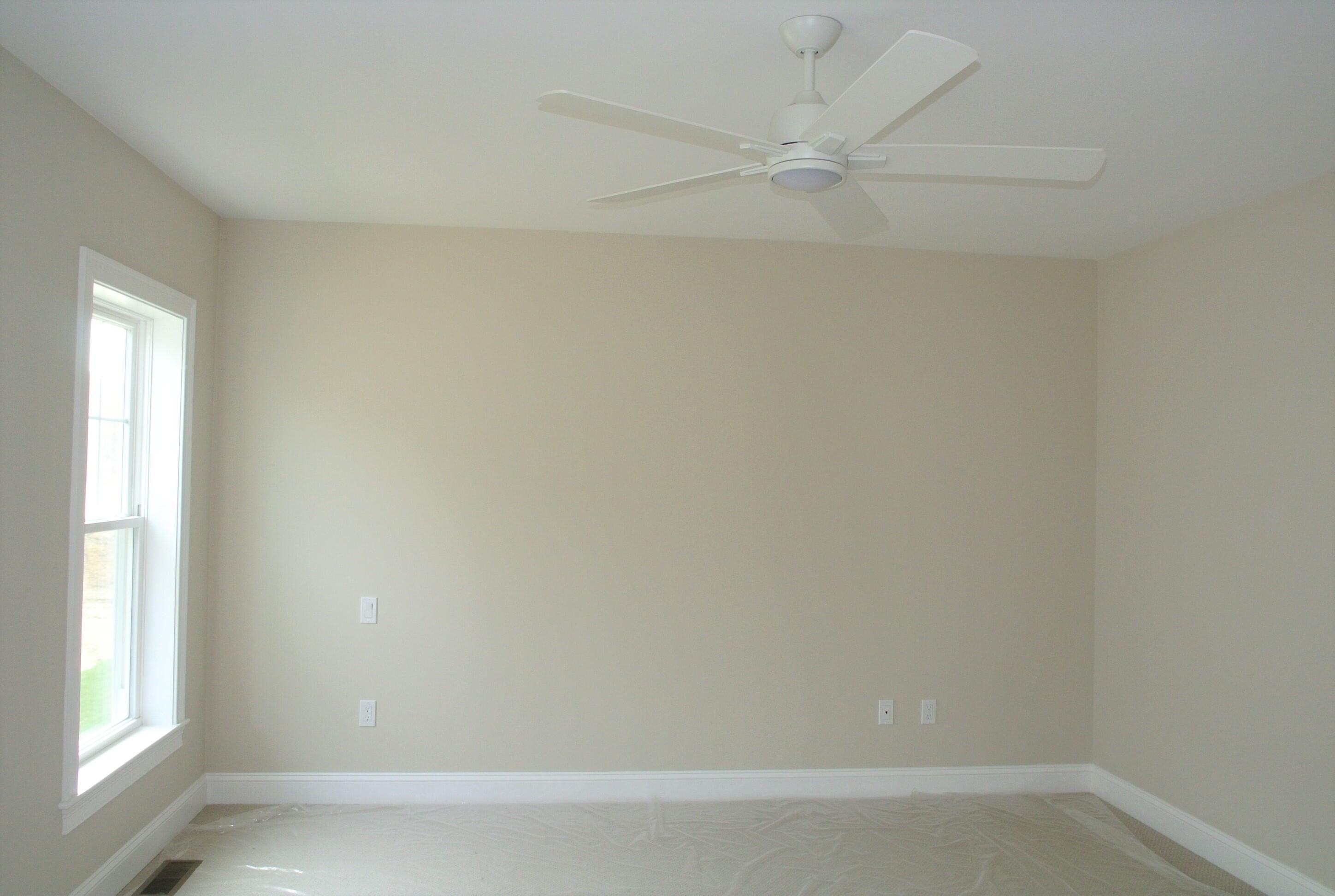 18 Cobblestone Circle Mashpee, MA 02649 - Photo 18 of 41 an empty room with a window and a fan