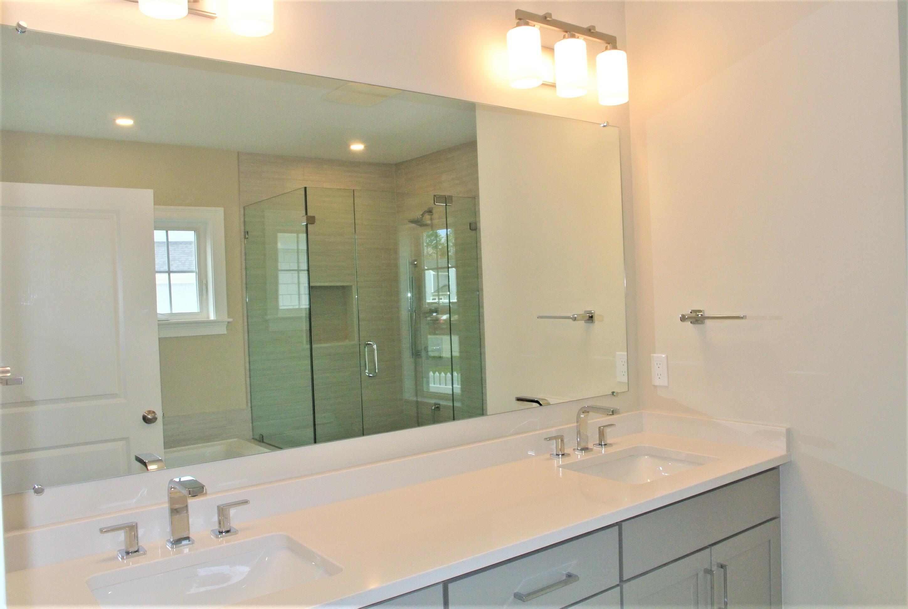 18 Cobblestone Circle Mashpee, MA 02649 - Photo 19 of 41 a bathroom with a sink and a mirror
