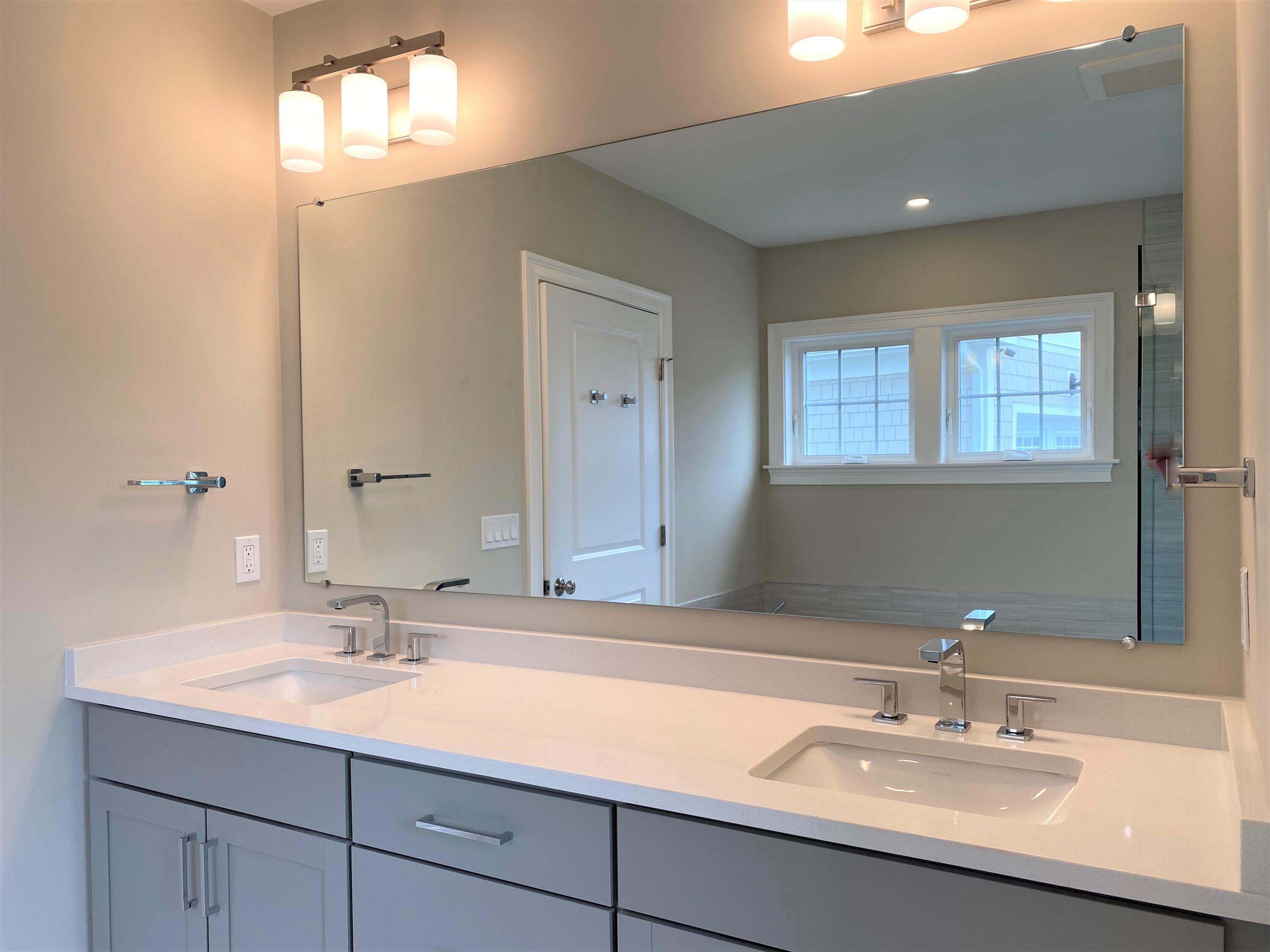 18 Cobblestone Circle Mashpee, MA 02649 - Photo 20 of 41 a bathroom with a sink and a mirror