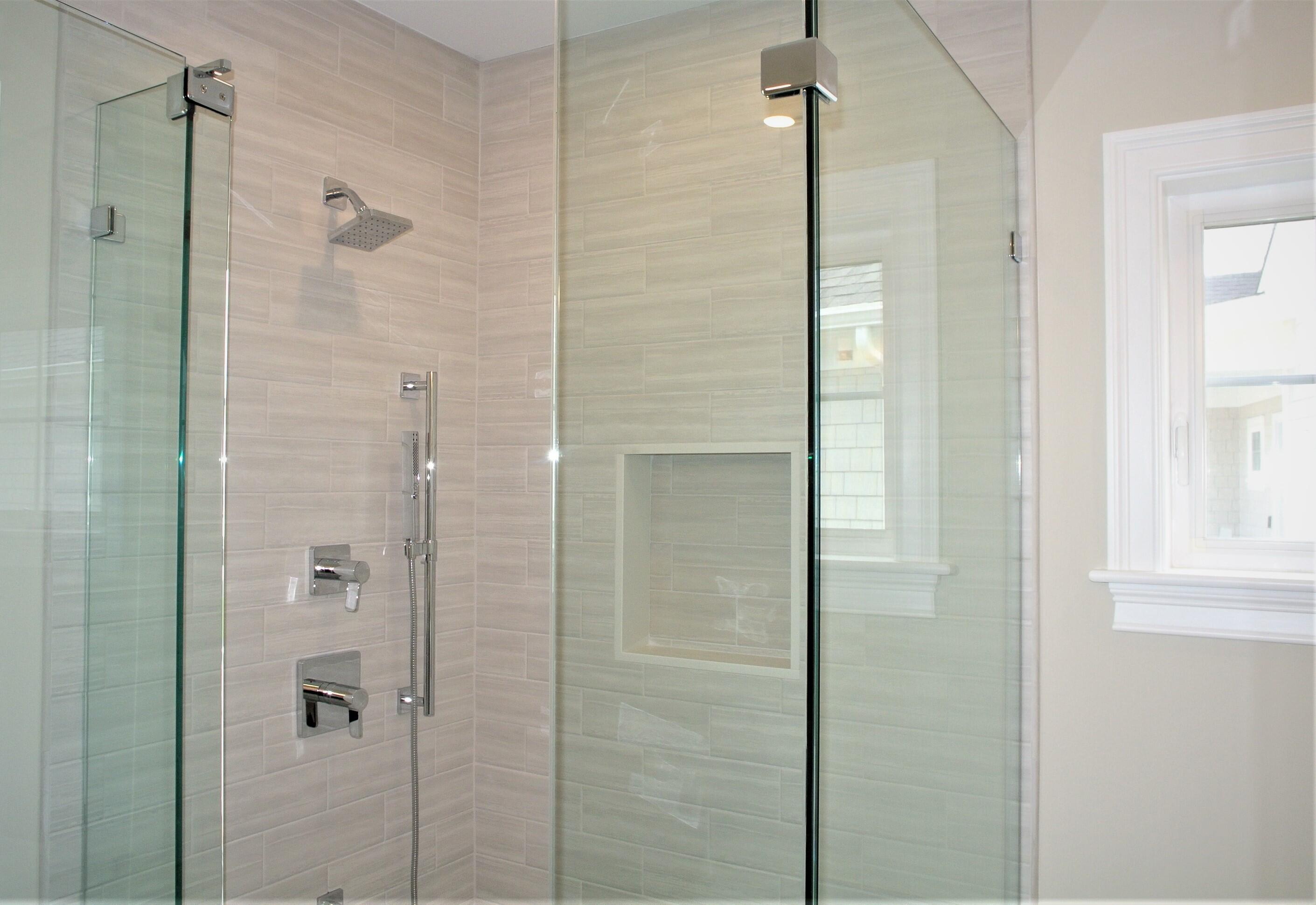 18 Cobblestone Circle Mashpee, MA 02649 - Photo 22 of 41 a bathroom with a shower and a glass door
