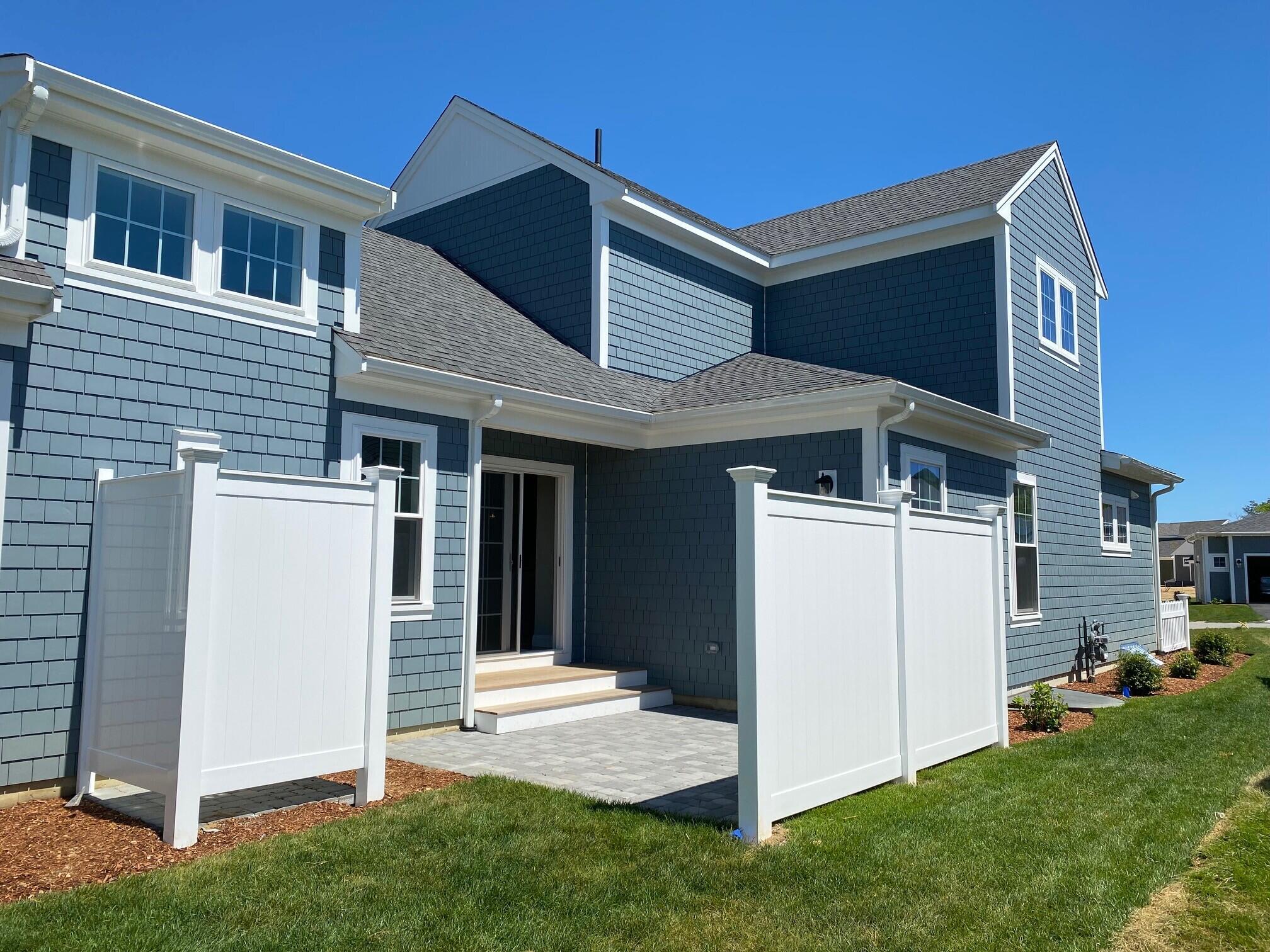 18 Cobblestone Circle Mashpee, MA 02649 - Photo 32 of 41 a front view of a house with a yard