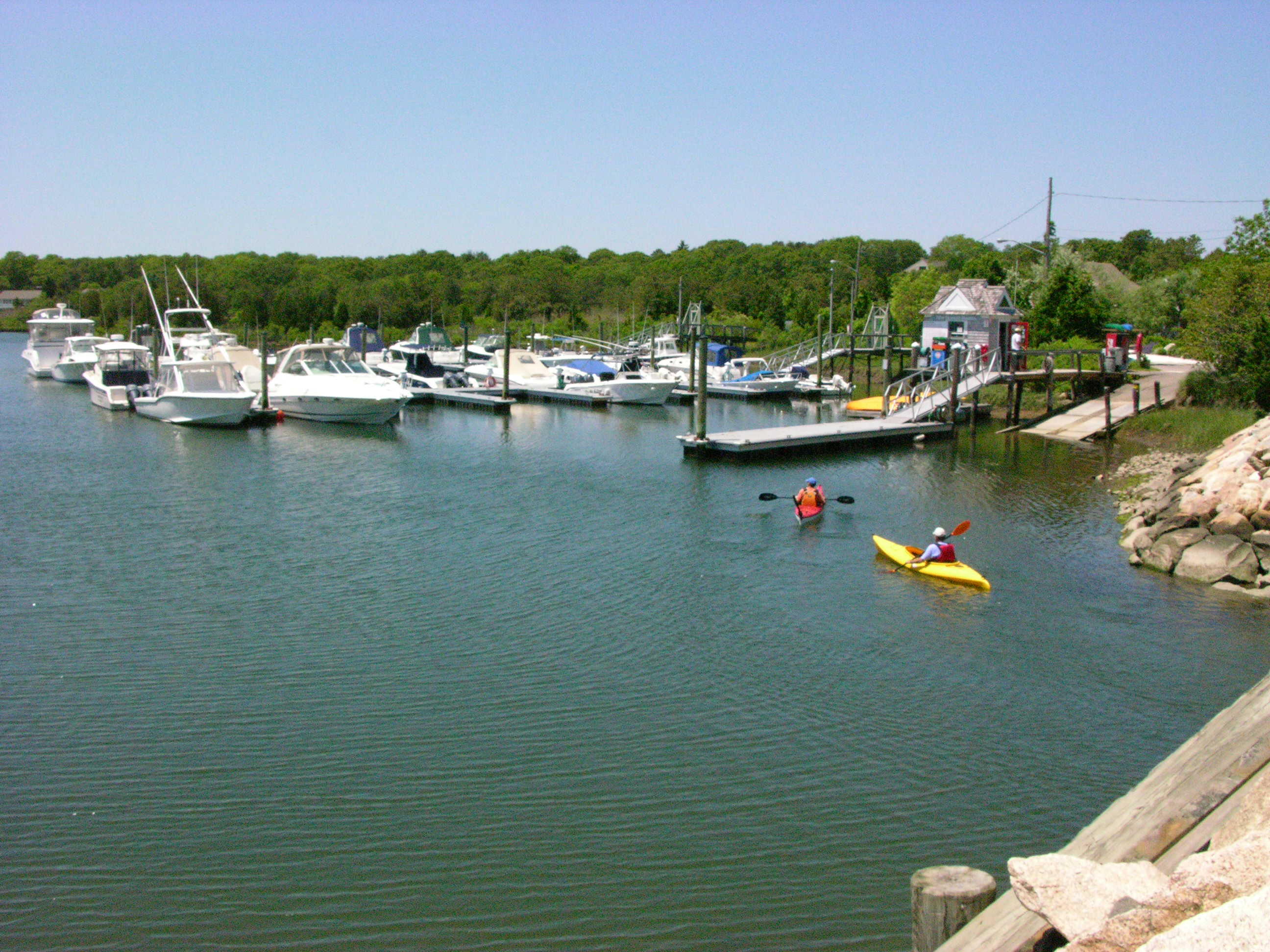 18 Cobblestone Circle Mashpee, MA 02649 - Photo 40 of 41 a view of a lake with boats and trees in the background