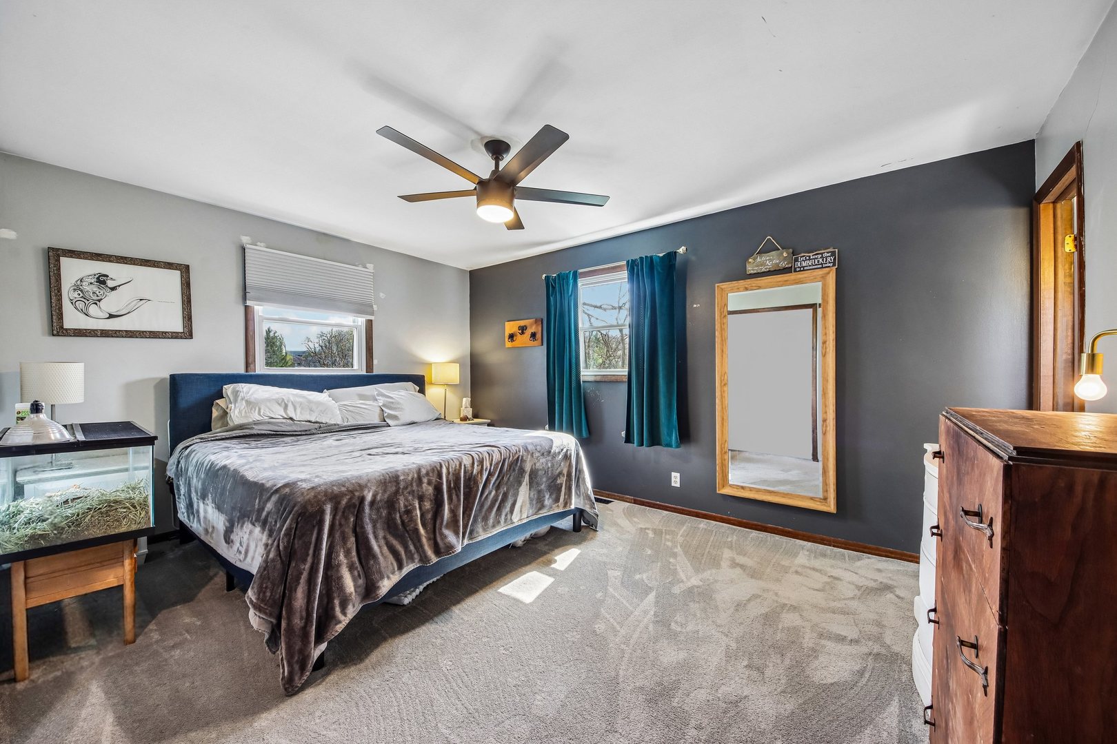 355 Council Trail Lake In The Hills, IL 60156 - Photo 11 of 35 a spacious bedroom with a large bed and a chandelier