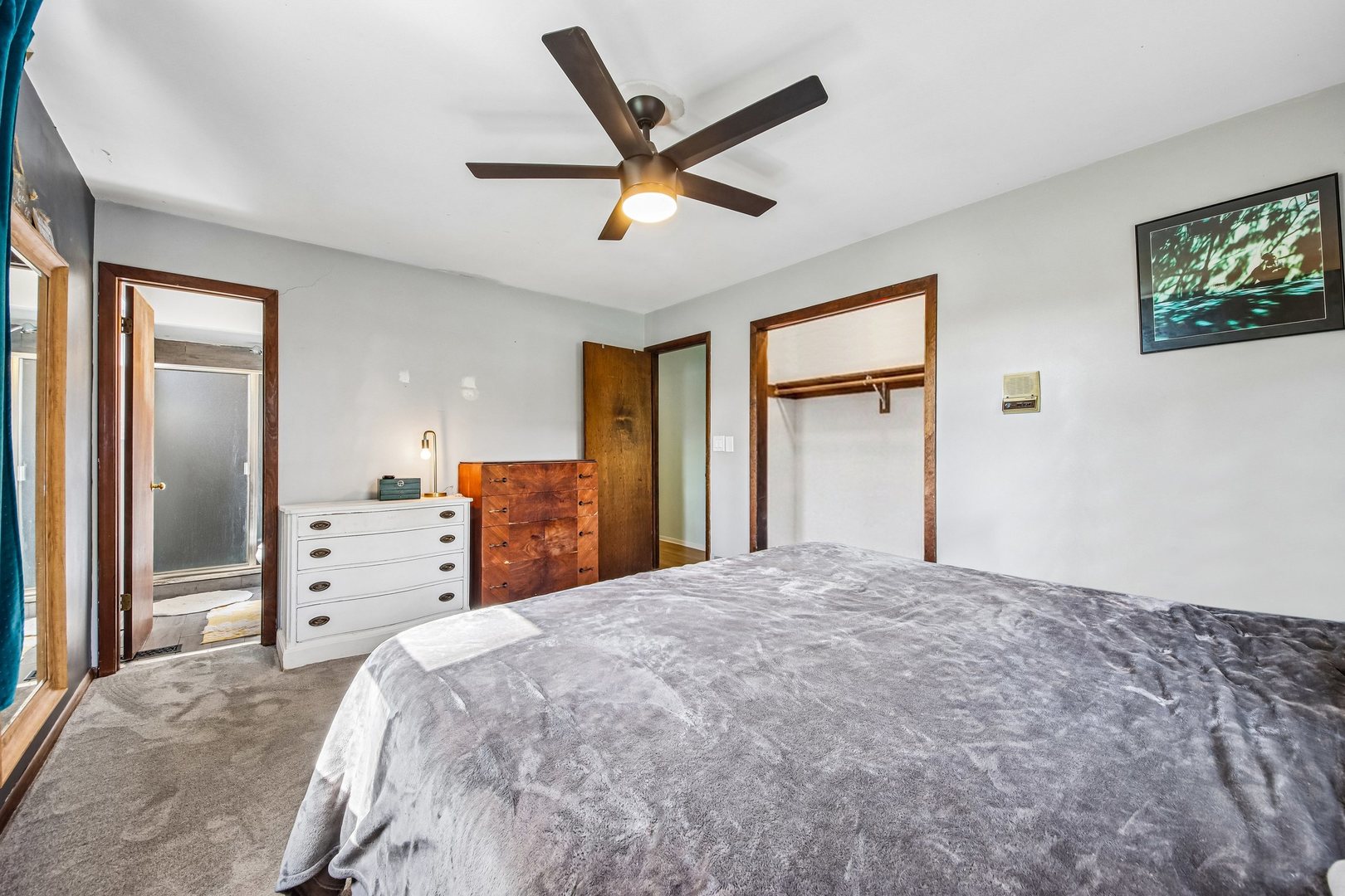 355 Council Trail Lake In The Hills, IL 60156 - Photo 13 of 35 a bedroom with a large bed and a large window