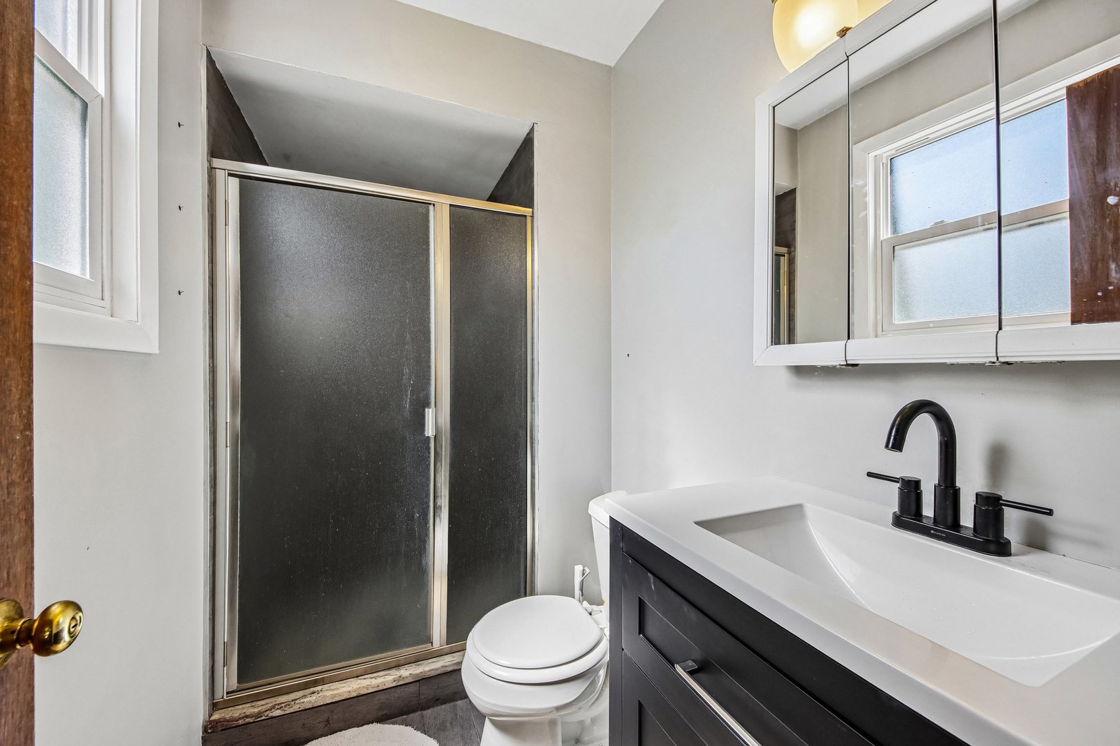 355 Council Trail Lake In The Hills, IL 60156 - Photo 14 of 35 a bathroom with a sink a toilet and shower