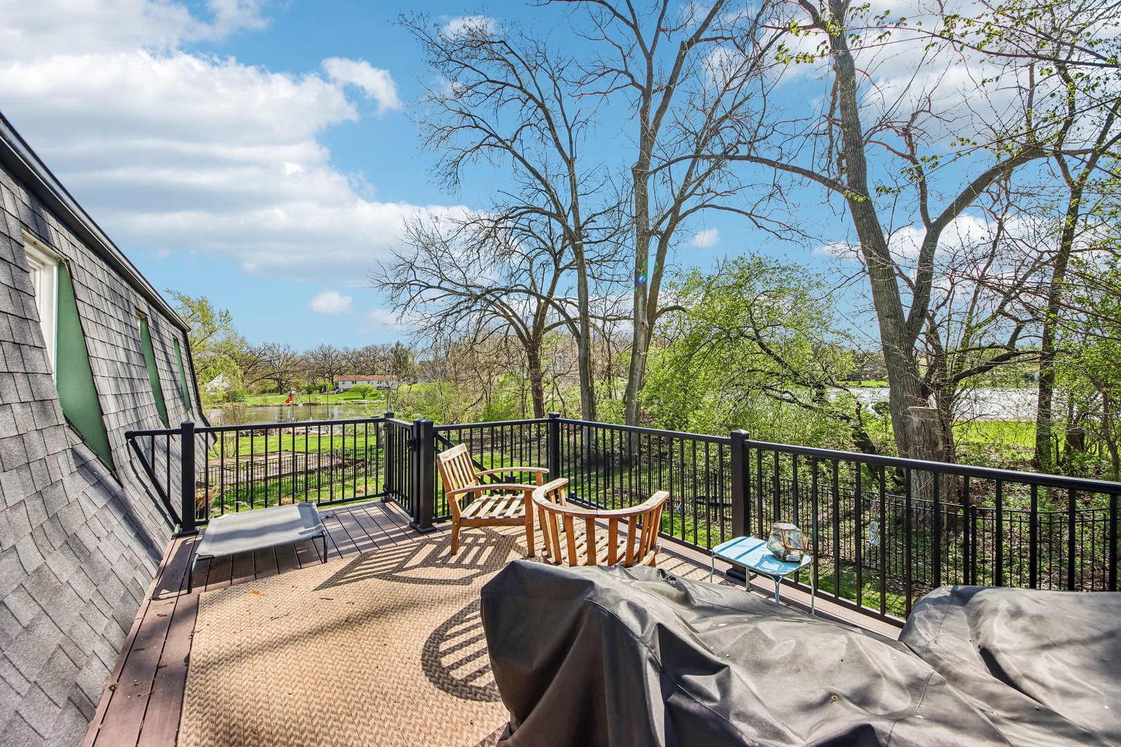 355 Council Trail Lake In The Hills, IL 60156 - Photo 28 of 35 a view of a balcony with two chairs and a table