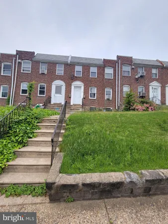 a front view of a building with garden