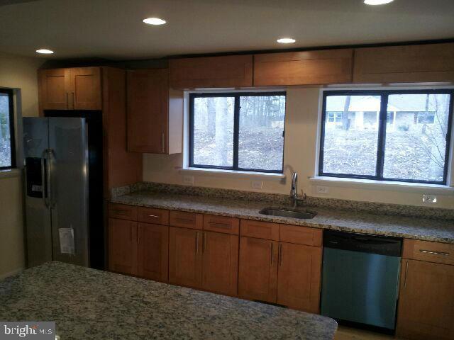 260 McCoys Ford Road Front Royal, VA 22630 - Photo 5 of 5 a kitchen with granite countertop a sink and a refrigerator