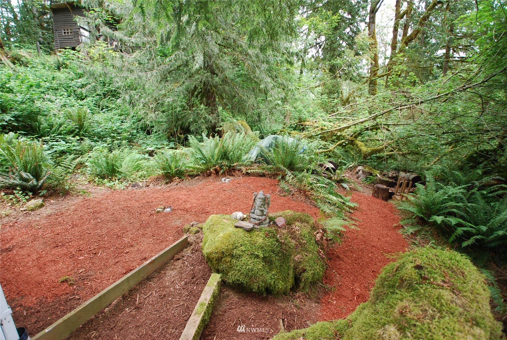 0 Wits End Road Gold Bar, WA 98251 - Photo 17 of 30 a view of a garden with a bench