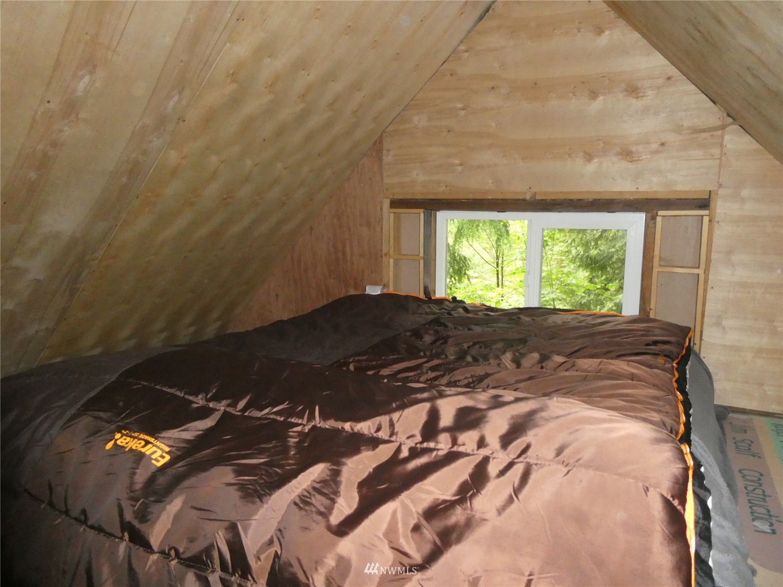 0 Wits End Road Gold Bar, WA 98251 - Photo 19 of 30 a bed sitting in a bedroom next to a window