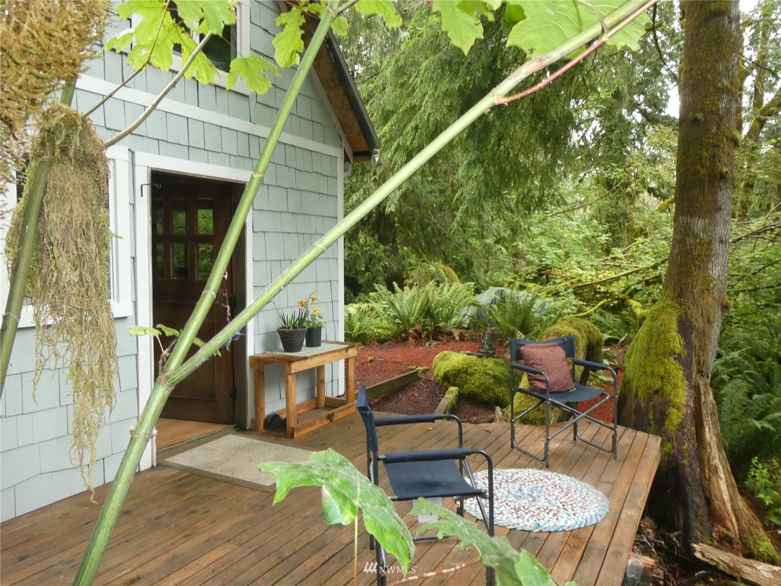0 Wits End Road Gold Bar, WA 98251 - Photo 20 of 30 a balcony with table and chairs with wooden floor and fence