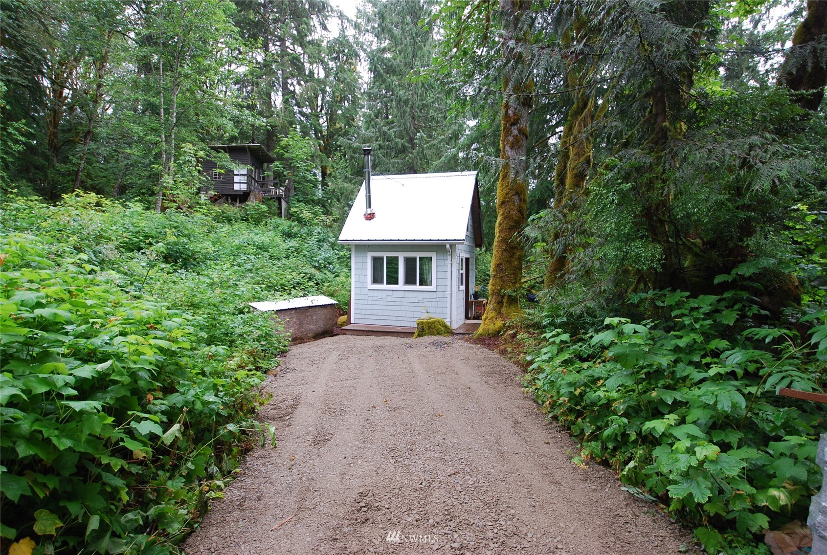 0 Wits End Road Gold Bar, WA 98251 - Photo 27 of 30 a view of a house with a yard and potted plants