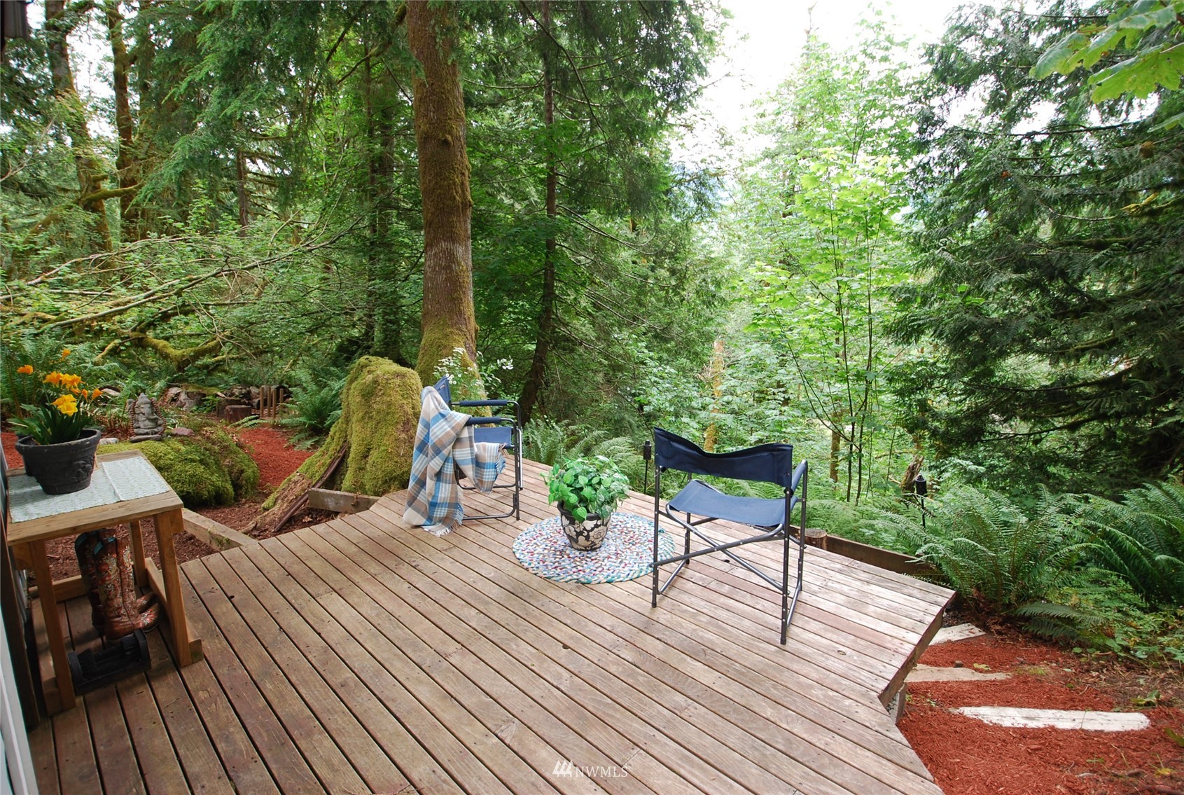 0 Wits End Road Gold Bar, WA 98251 - Photo 3 of 30 a view of a table and chairs on the roof deck