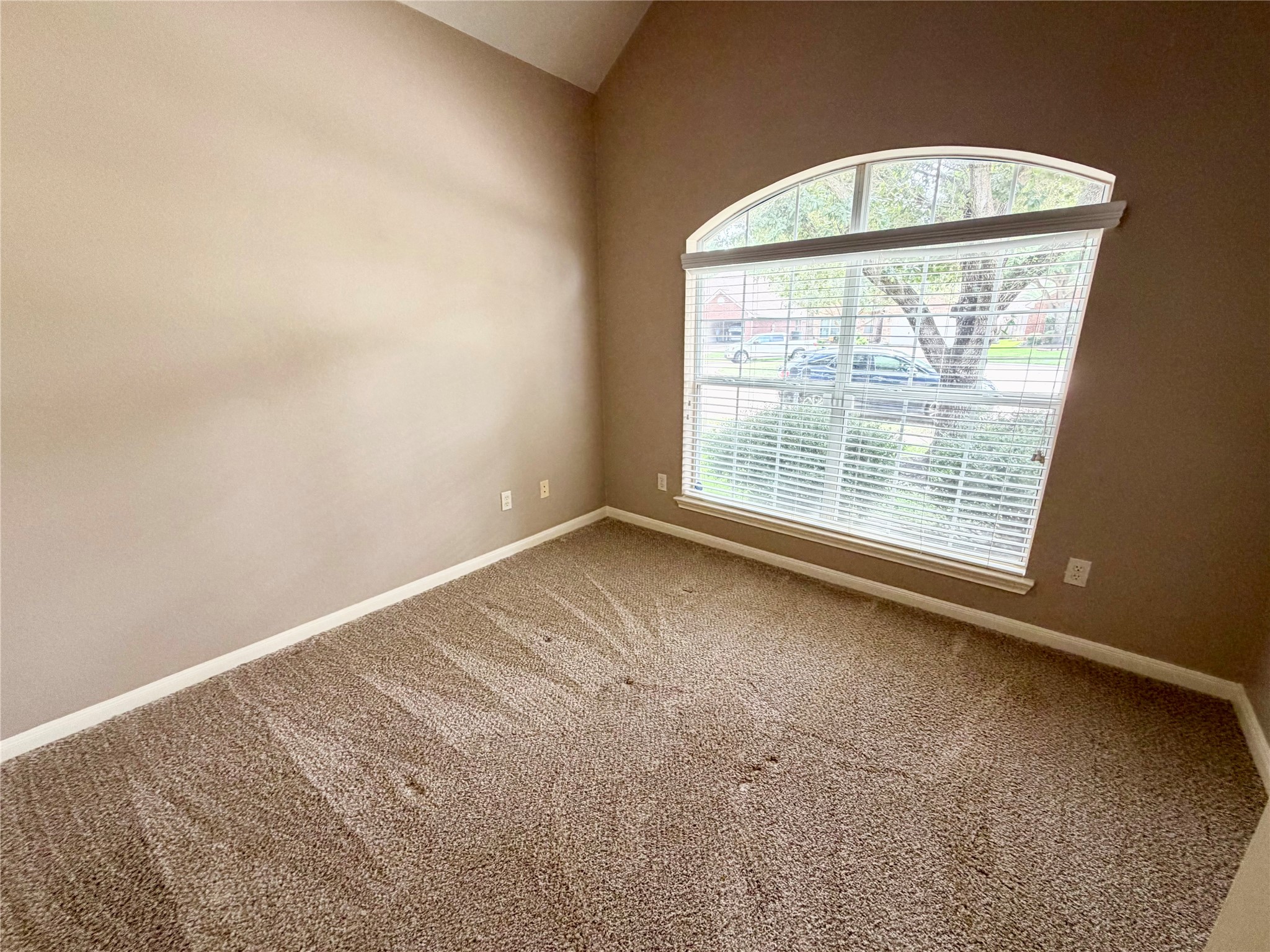 903 Cascade Ridge Katy, TX 77494 - Photo 16 of 24 an empty room with a window