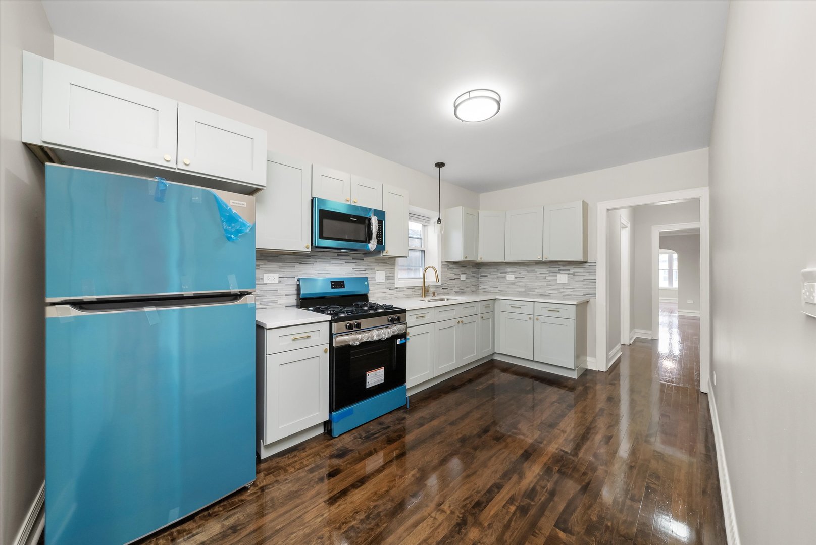 8331 South Morgan Street Chicago, IL 60620 - Photo 21 of 40 a kitchen with a refrigerator stove and sink