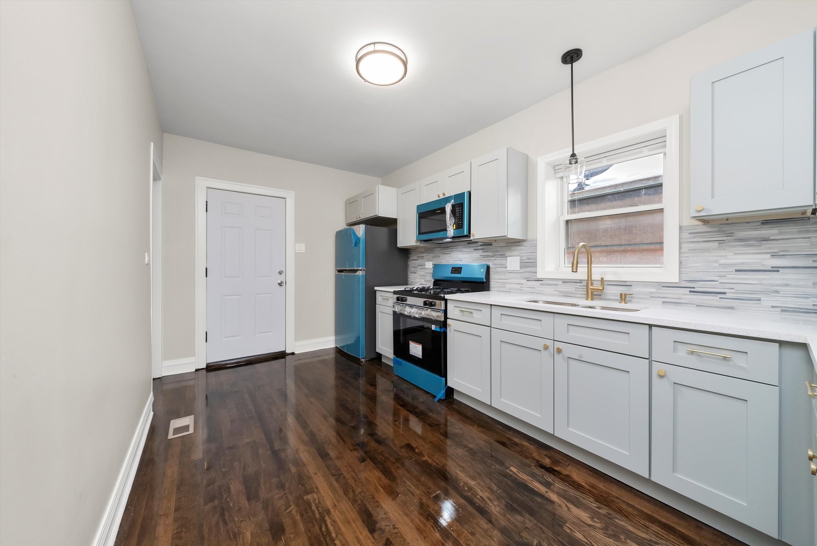 8331 South Morgan Street Chicago, IL 60620 - Photo 22 of 40 a kitchen with sink cabinets and window