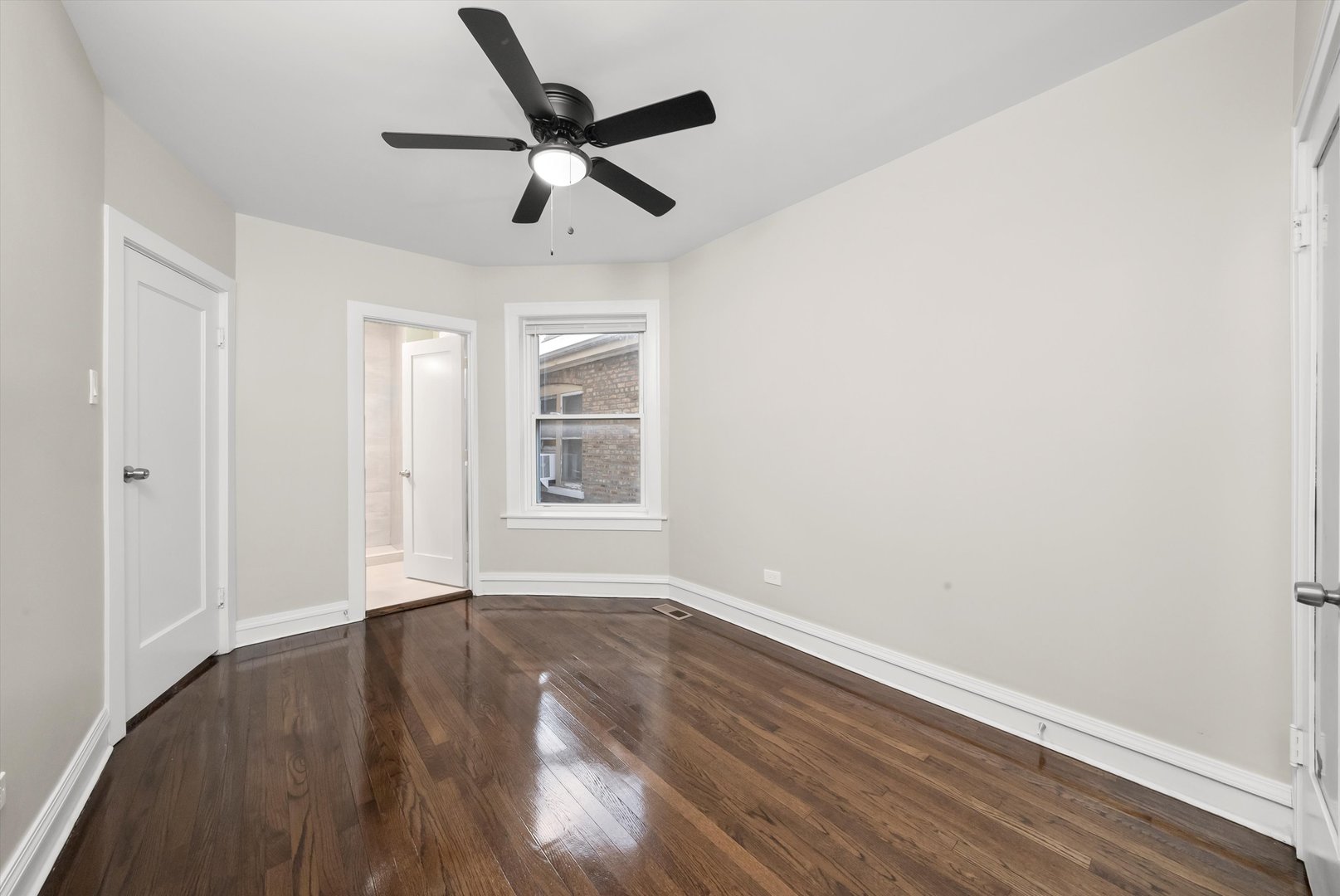 8331 South Morgan Street Chicago, IL 60620 - Photo 27 of 40 wooden floor in an empty room with a window