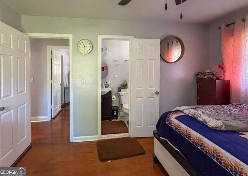 724 Camelot Way Norcross, GA 30071 - Photo 4 of 11 a bedroom with a bed and a window