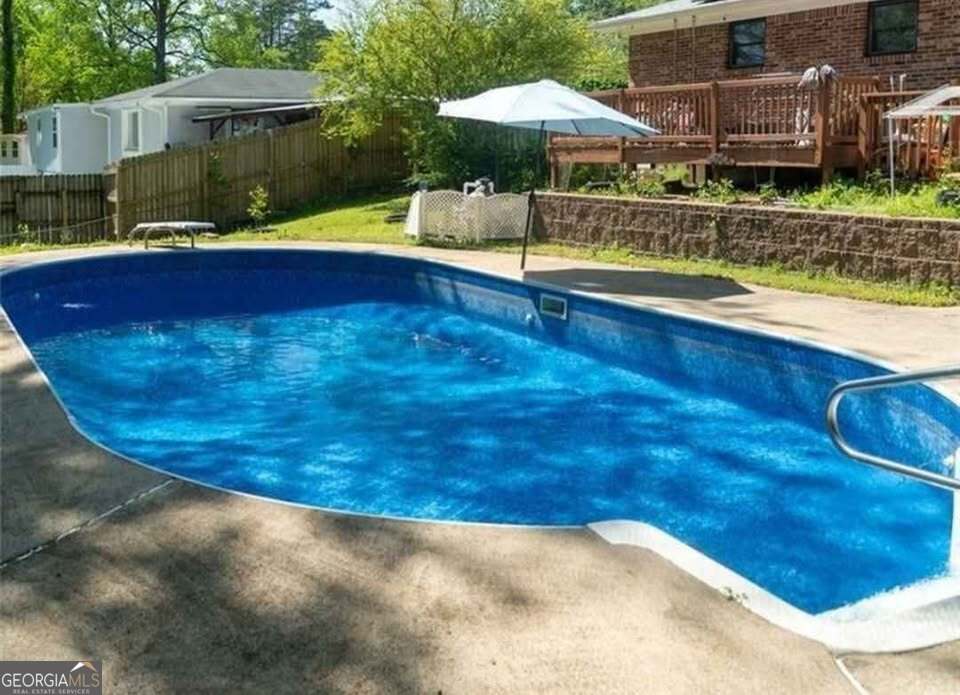724 Camelot Way Norcross, GA 30071 - Photo 5 of 11 a view of swimming pool with an outdoor seating