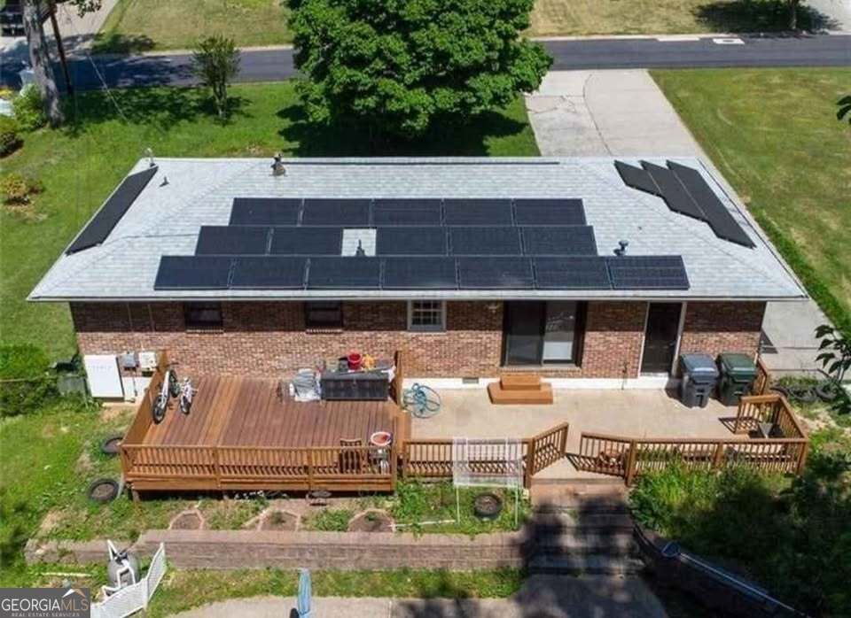 724 Camelot Way Norcross, GA 30071 - Photo 7 of 11 a view of a patio with table and chairs potted plants